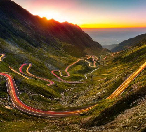 Traffic trails on Transfagarasan pass at sunset. Crossing Carpathian mountains in Romania, Transfagarasan is one of the most spectacular mountain roads in the world.